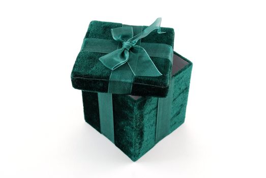 Green gift box with a laced up bow