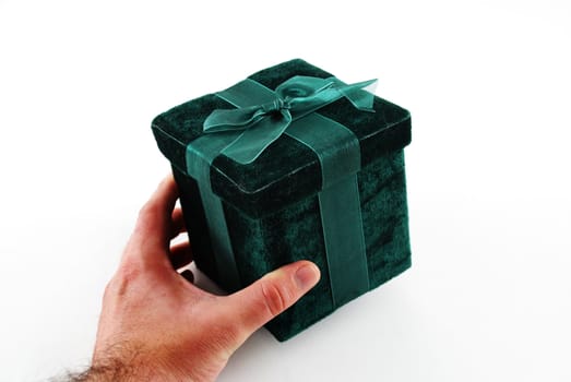 Green gift box with a laced up bow