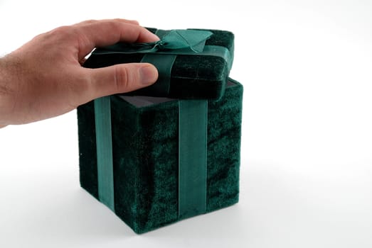 Green gift box with a laced up bow