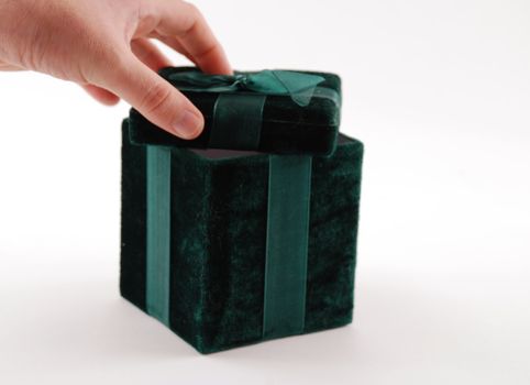 Green gift box with a laced up bow