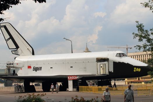 spacecraft "Buran" against the background of an amusement park vacation