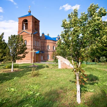 Red brick church with blue roof, Russia