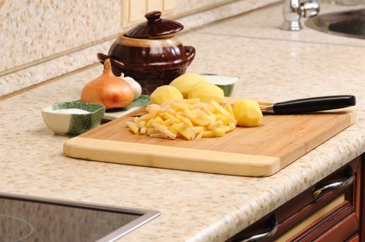 Meal preparation on kitchen from a potato