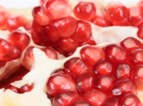 Pomegranate grains in a plate shot close-up