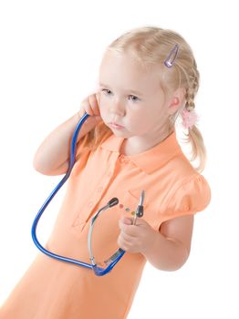 Shot of little girl with sthetoscope on  hand