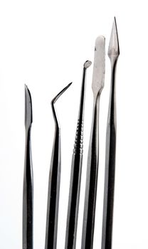 Stock pictures of metal dental instruments used to work on patients