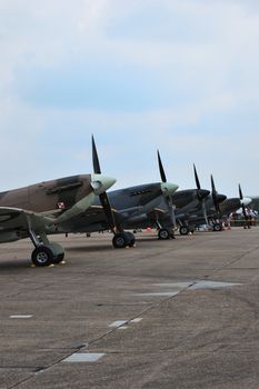 Line of world war 2 aircraft on runway