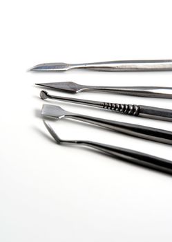 Stock pictures of metal dental instruments used to work on patients