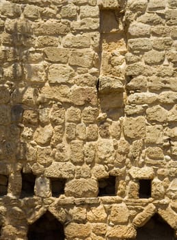 Wall constructed of stone bricks. A fine textural background for graphic design