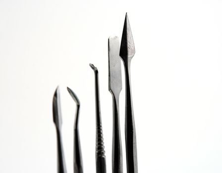 Stock pictures of metal dental instruments used to work on patients