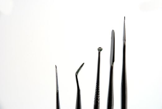 Stock pictures of metal dental instruments used to work on patients