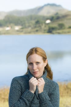 Portrait of a Pretty Redhead Woman Outdoors