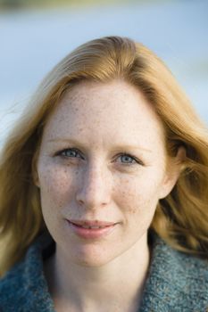 Portrait of a Pretty Redhead Woman Outdoors