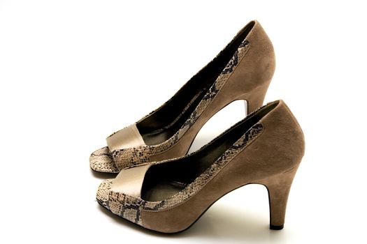 Elegant female shoes with a high heel on a white background.