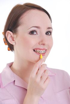 Dental hygenist cleaning teeth with braces