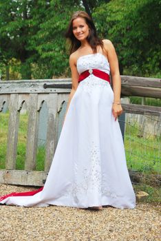 pretty girl standing in wedding dress