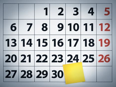 Close up of a blank sticky note on a calendar post it on the 31st day.