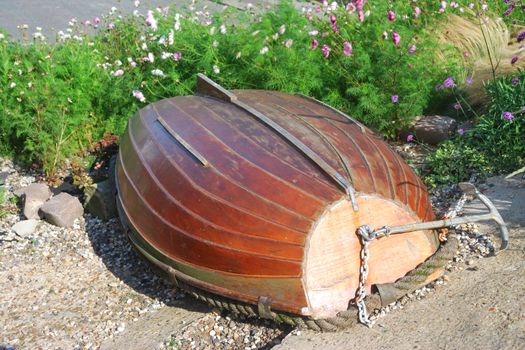 overturned rowing boat among flowers