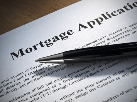 Close up of a mortgage application and a pen.