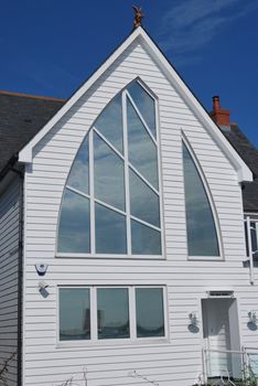 Luxury home with sail shaped window