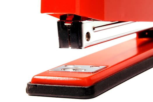 Working part of a stapler photographed close up on a white background