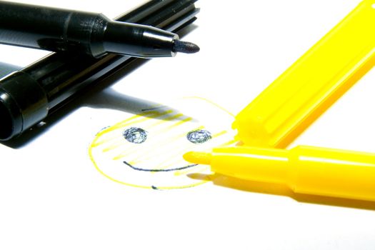 Color felt-tip pens photographed close up on a white background