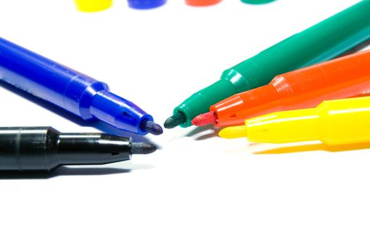 Color felt-tip pens photographed close up on a white background