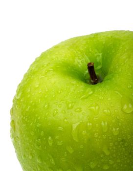 Green apple with water drops. Close-up