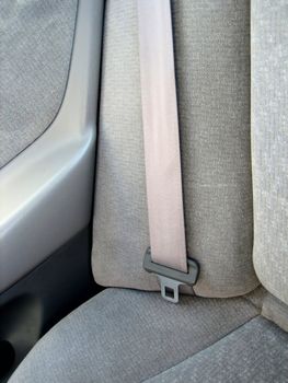 Picture of close ups of seat belts and other safety and restraining devices in cars