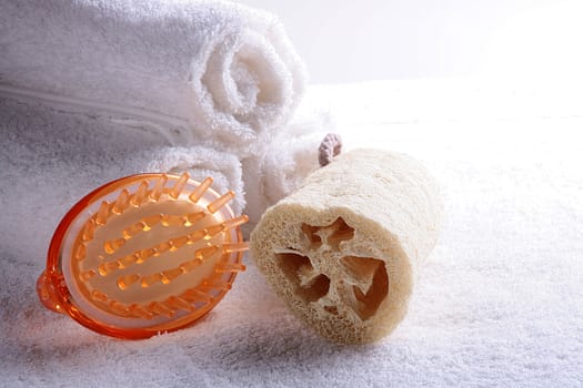 Massage brush and bast made of a natural material against terry towels.