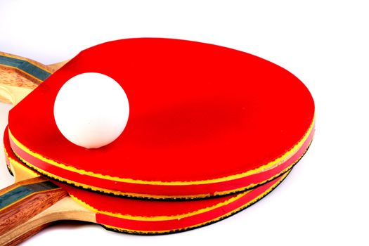 White ball for game in Ping-pong on rackets for this game. Two surfaces red and black have rackets.