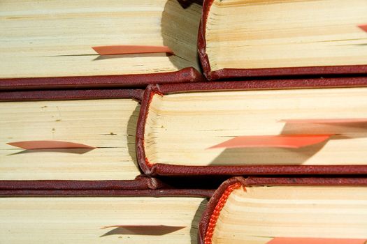 Old books in darkly red covers