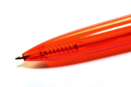 Pen make from red transparent plastic on white background