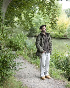 Man standing on a canal towpath