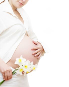 Part of pregnant woman with flower over white, last trimester