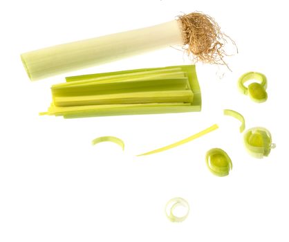 Arrangment of leek pieces and slices over white background