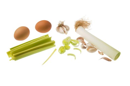 Eggs, leek and garlic isolated against white background.