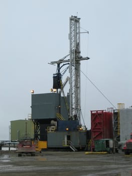 Oil and petroleum extraction site including drilling wells and pipeline for transportation of crude oil