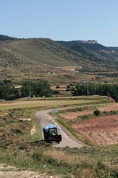 Old woodcutting tractor in mountains