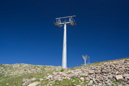 summer view of ski lift under a deep blue sky. Photo taken with polarized filter