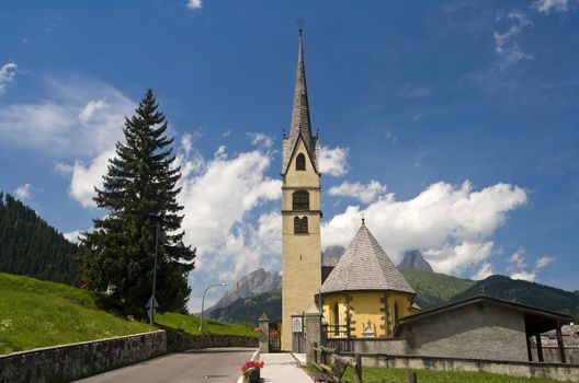 small church in Alba di Canazei, Trentino, Italy. Canazei is a famuos small town in val di Fassa, Italian dolomites. Photo taken with polarized filter