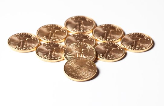 Solid gold eagle coins in the shape of a diamond