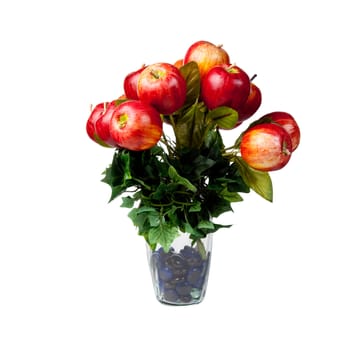 Glass vase holding apples in an arrangement for a center piece on a table decoration