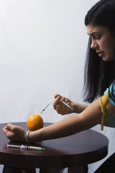 Young model portrays seeking nutrition through extreme measures.