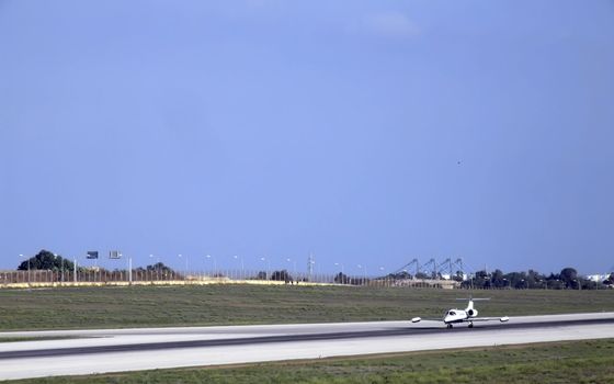 Civil aircraft poised for take-off at an airfield in Malta