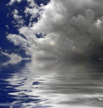 Clouds looming over the horizon with deep blue sky in background