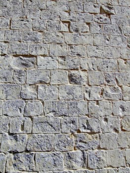 Detail and texture of medieval buildings. Limestone wall in Malta.
