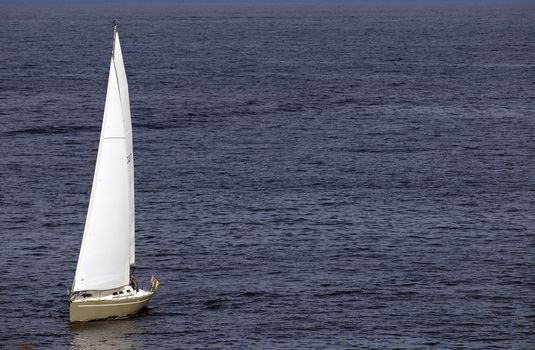 Yacht sailing across the deep blue azure waters of the Mediterranean Sea