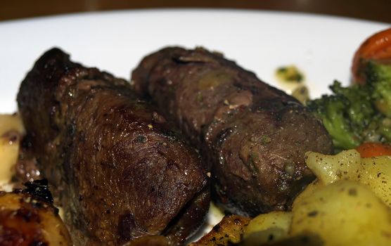 Rolled meat, or bragioli, as known in Mediterranean cookery   
