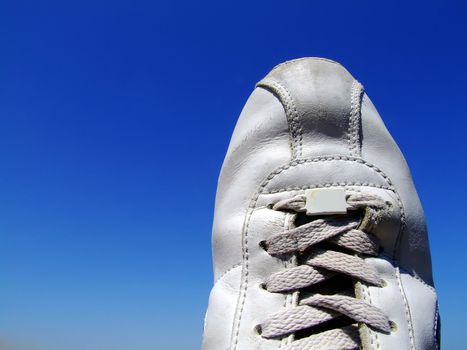 Detail shot of old worn out sneakers, depicting the sneaker culture